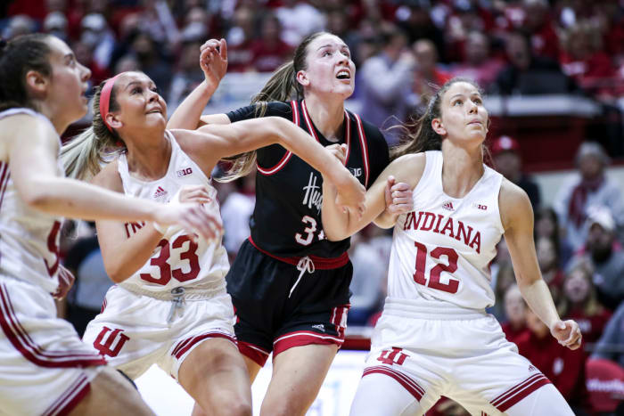 Sydney Parrish (33) and Yarden Garzon (12) box out on Nebraska forward Isabelle Bourne (34) in Simon Skjodt Assembly Hall on Jan. 1, 2023.